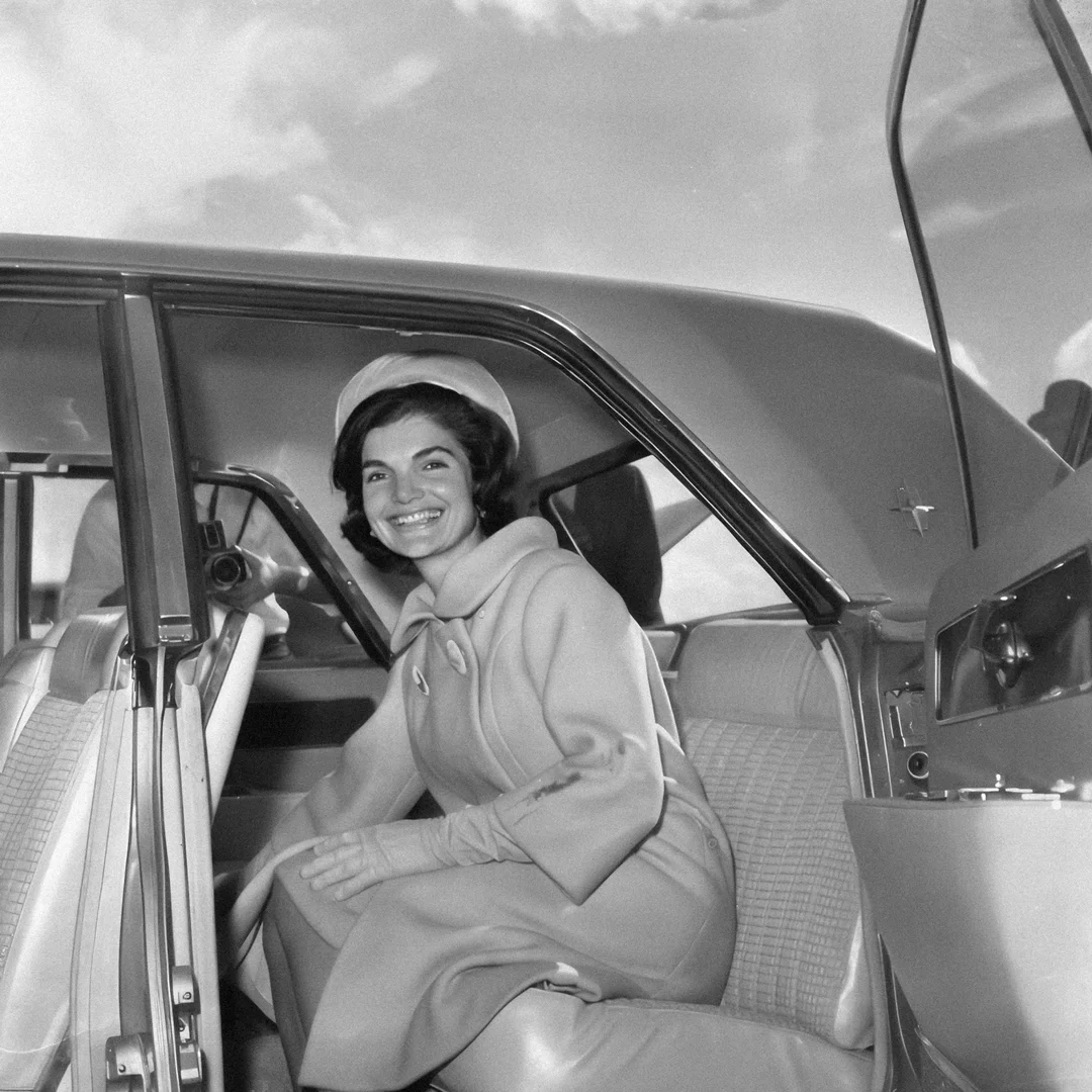 Jacqueline Kennedy seated in an elegant interior